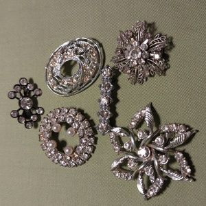 Six vintage silver tone brooches